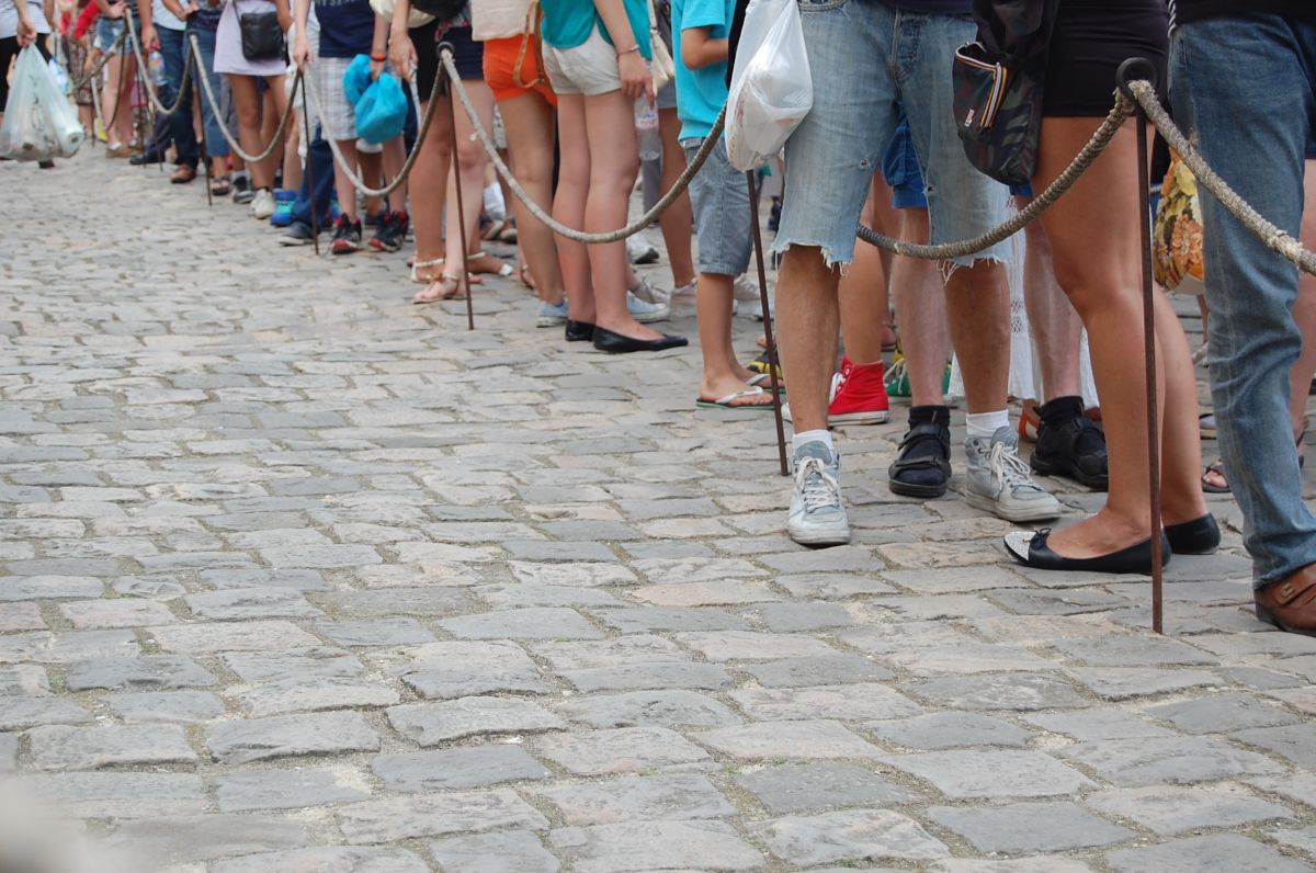 People standing patiently in an orderly line in Japan