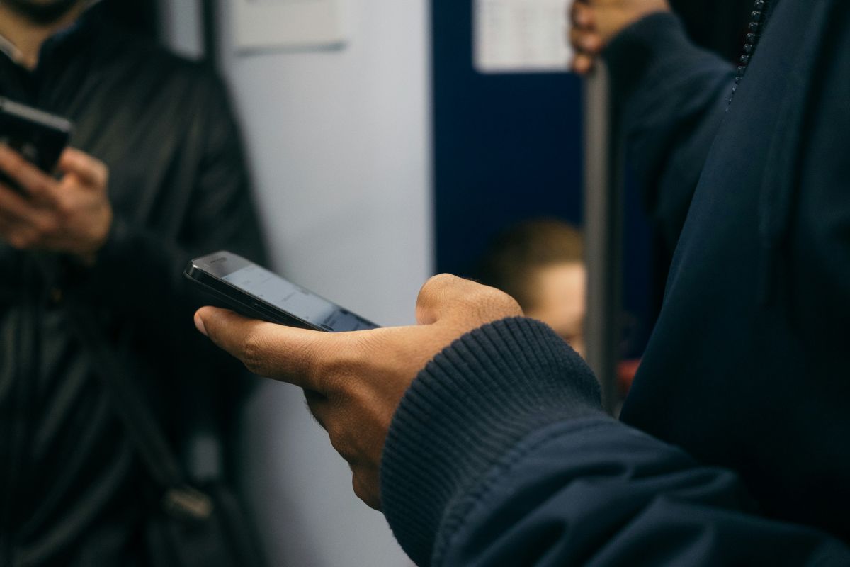 People riding a train quietly without talking on their phones in Japan