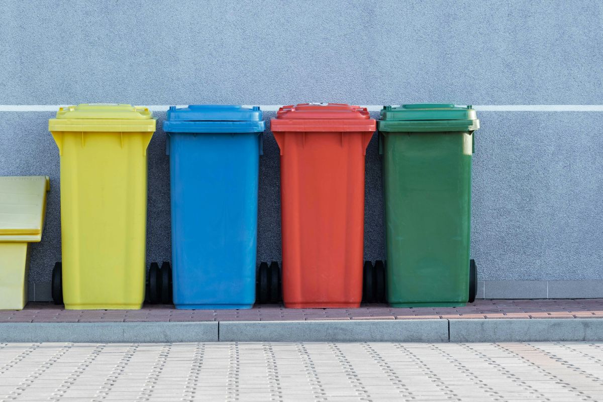 Different categories of recycling and trash bins used in Japan for waste separation.