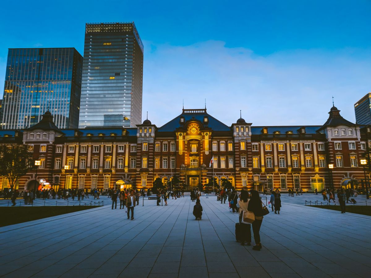 A Japanese train station food area featuring ekiben lunch boxes, bakeries, and local specialty foods.