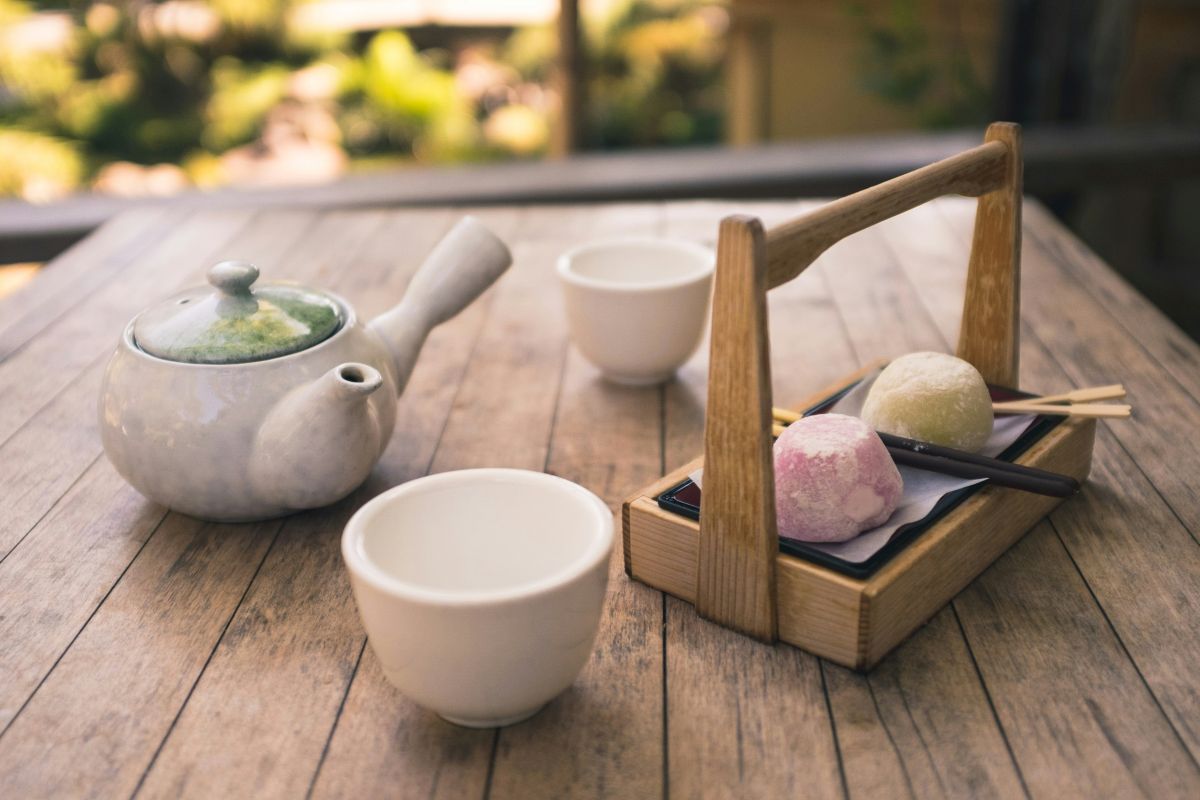 A cup of traditional Japanese green tea served with Japanese sweets