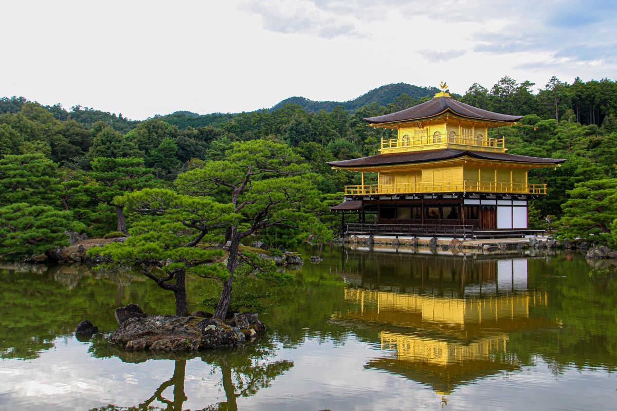 Peaceful Zen temple garden with rocks, moss, and maple trees in Japan