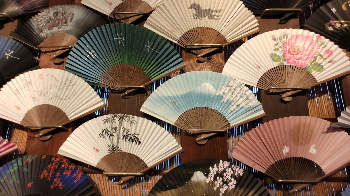 Traditional Japanese folding fan with elegant seasonal patterns