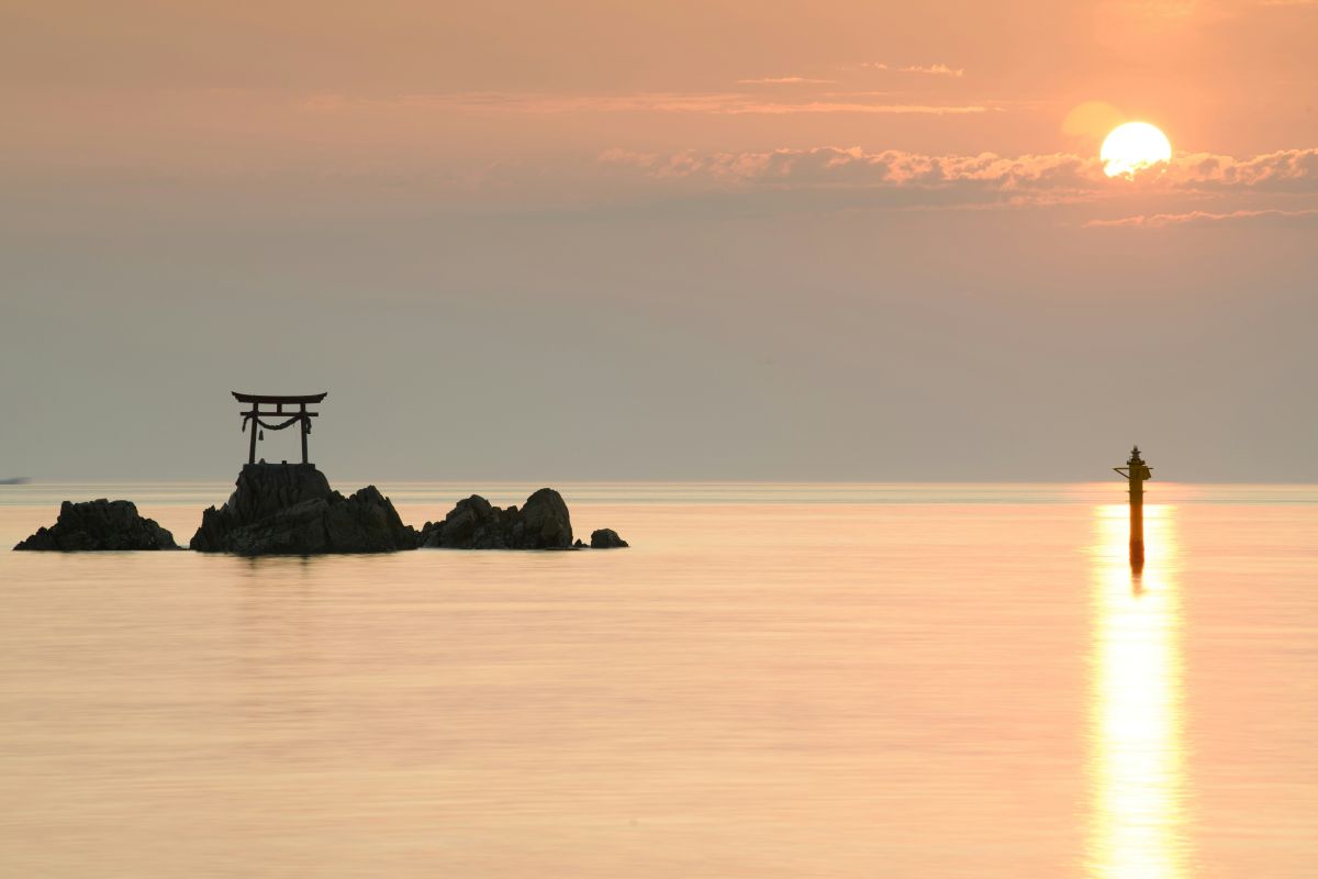 Beautiful sunset over a Japanese coastline with orange evening sky