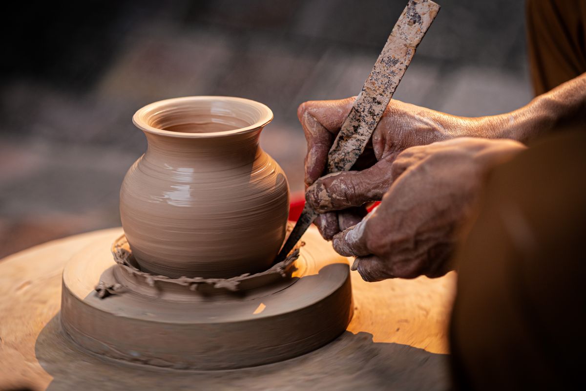 A Japanese craftsman carefully making traditional handmade products in a workshop