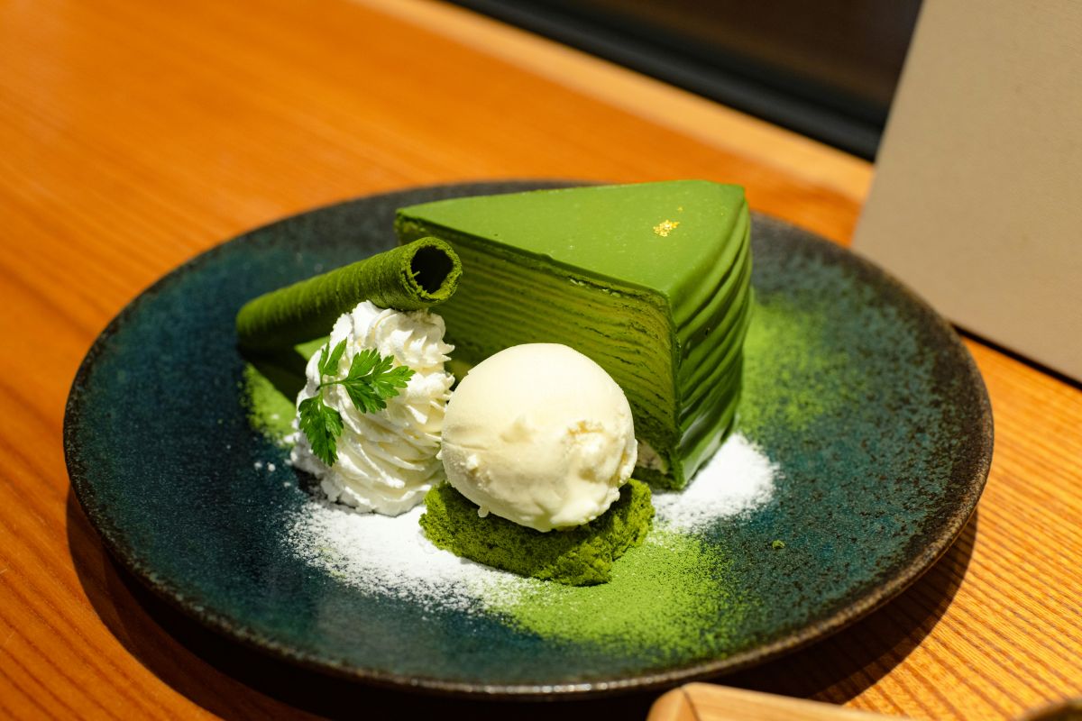 selection of Japanese matcha sweets including ice cream, cake, wagashi, and cookies.