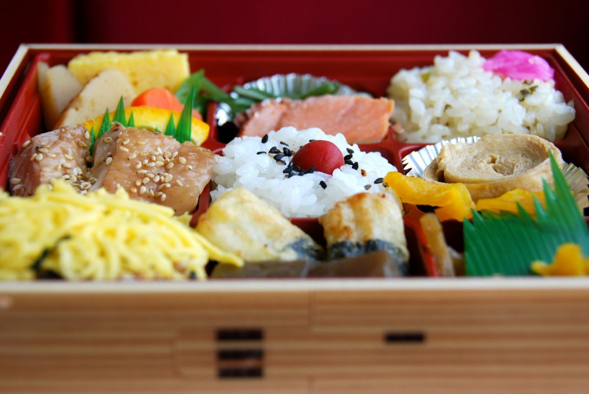 Colorful homemade Japanese bento lunch with rice, vegetables, and side dishes